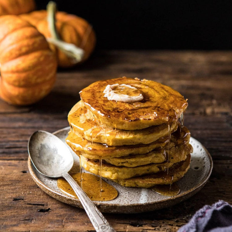 Fuel Your Fall with a stack of Fierce Fuel Pumpkin Spiced Pancakes on a plate.