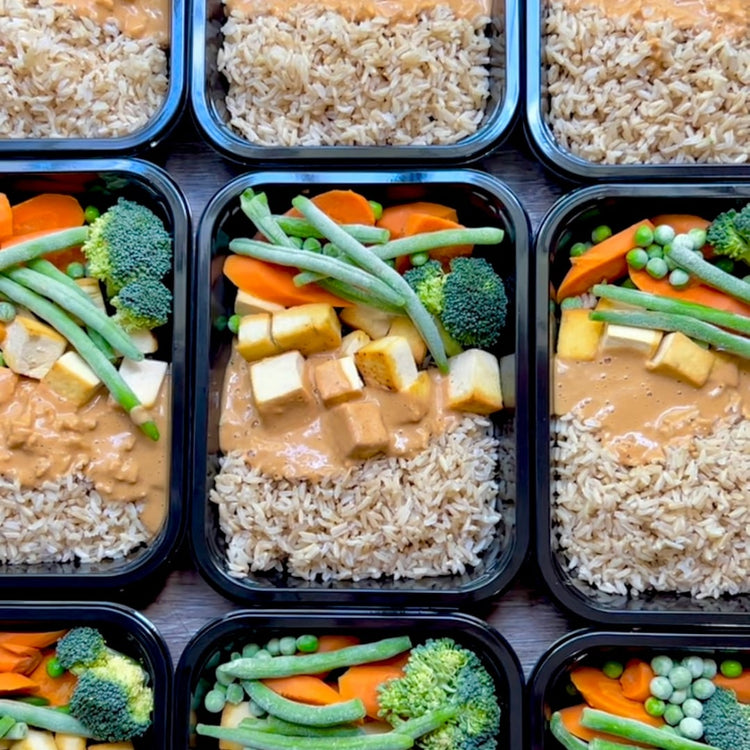 Fierce Fuel Thai meal prep containers with Peanut Satay Tofu, Brown Rice & Veggies for dipping.