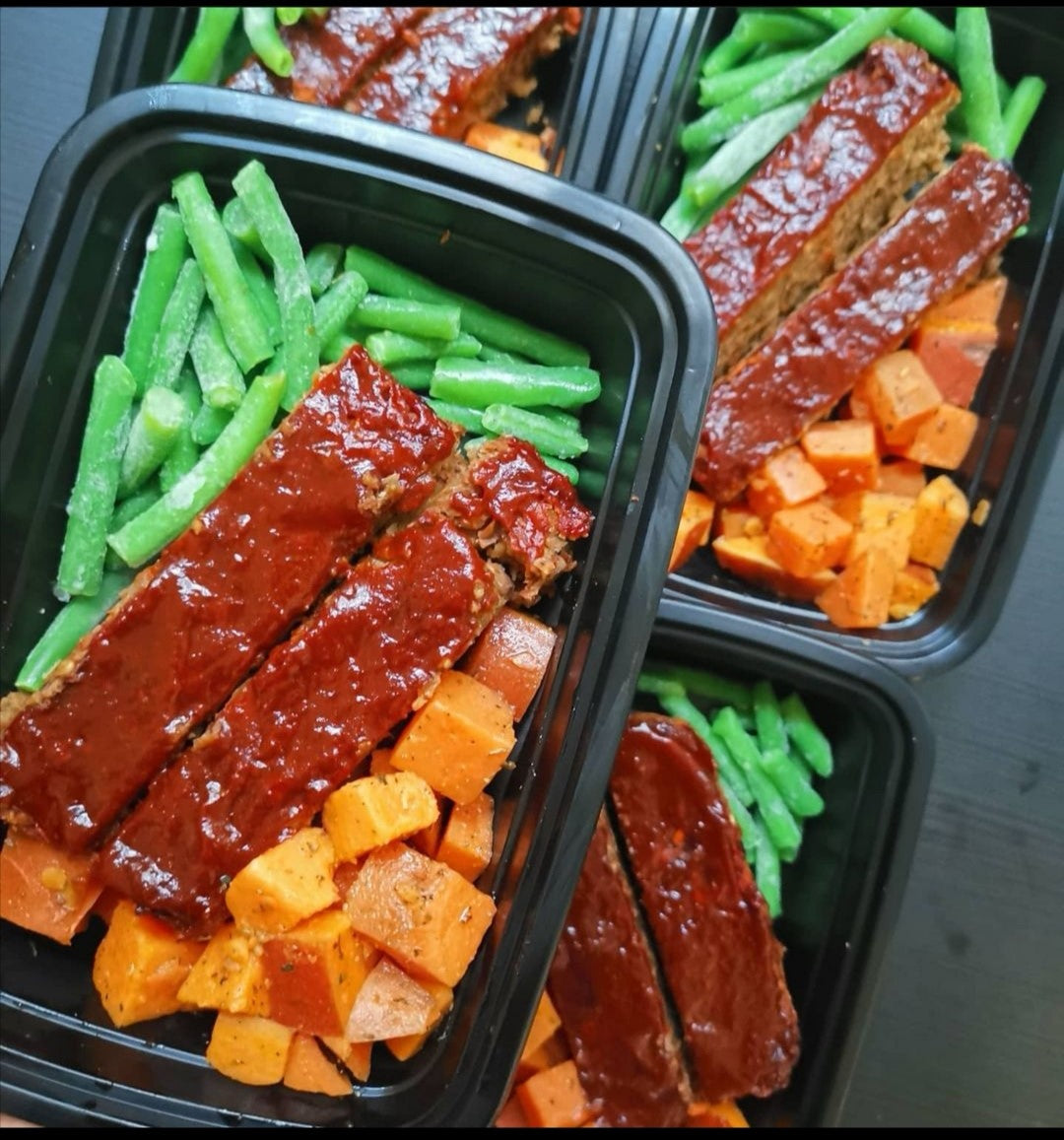 Ready-made healthy meals, including Lentil Loaf & Roasted Sweet Potato, sweet potatoes and green beans in plastic containers (Fierce Fuel, Squamish).