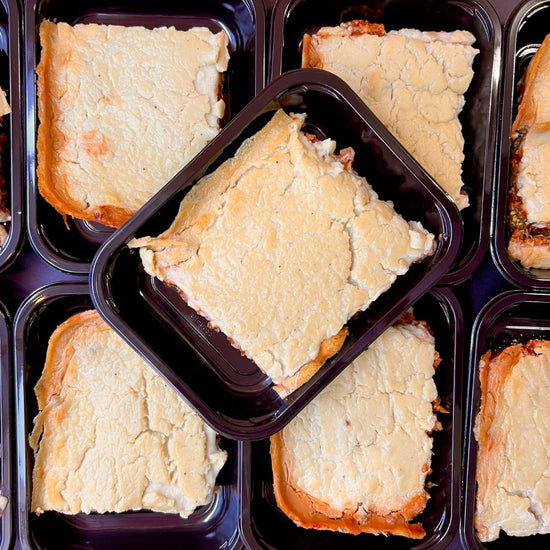 A group of ready-made Greek Moussaka dishes delivered in Fierce Fuel plastic trays.